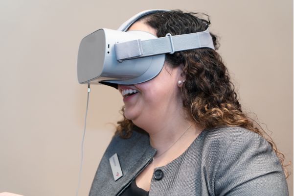 Bank of America employee wearing VR goggles | Disruptive innovation